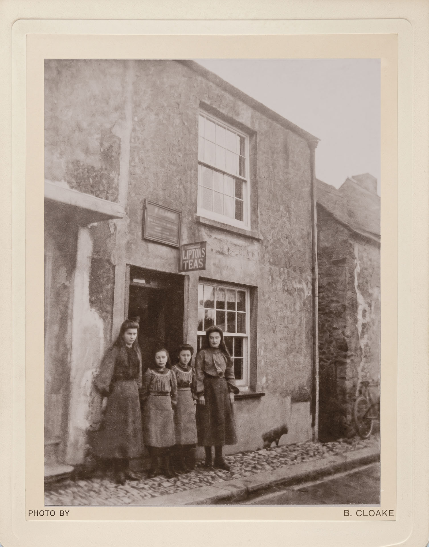 Step-sisters Jane Gill, Ida and Irene Cloake, and probably Elizaberth Gill- outside the unrealted Gill grocer shop, Cargreen c1901-1902