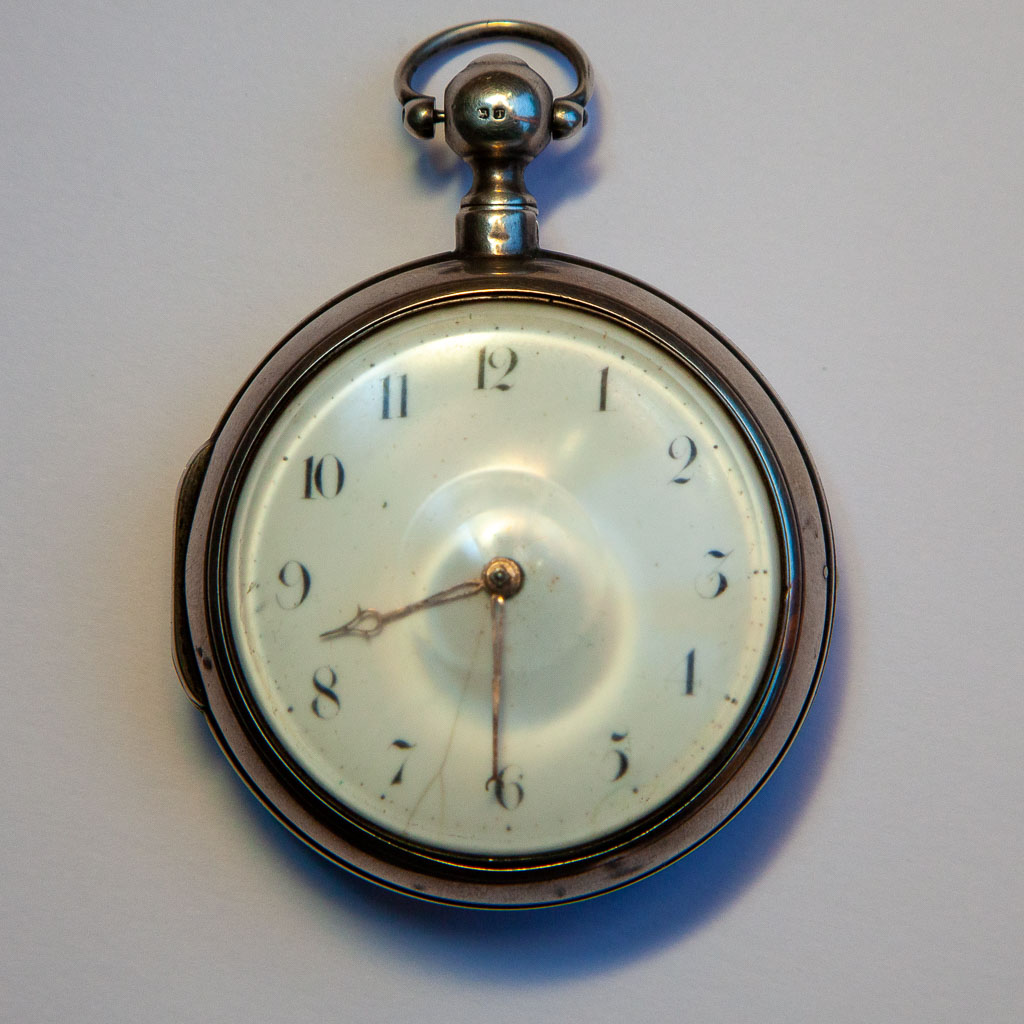 The watch face with white enamel dial