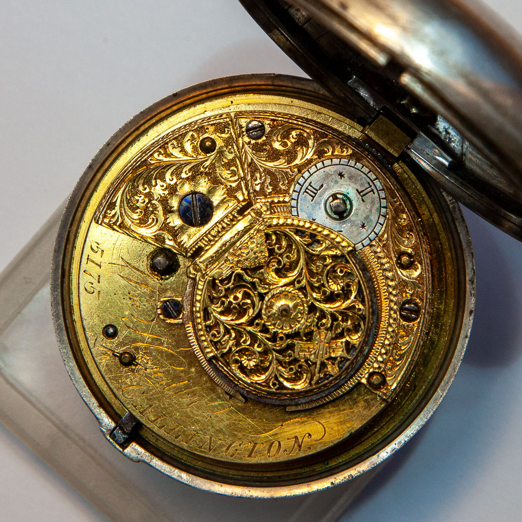 The gilded movement showing William Hambly's signature